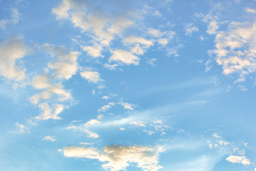 Blue sky with white clouds at sunset