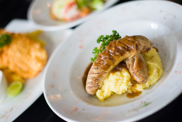 Grilled beef sausages with mashed potato