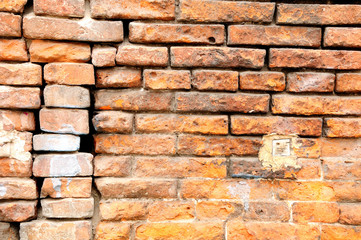 Ramshackle wall of old building in Verona. Italy.