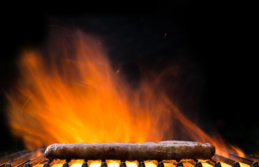Grilled sausages on fire