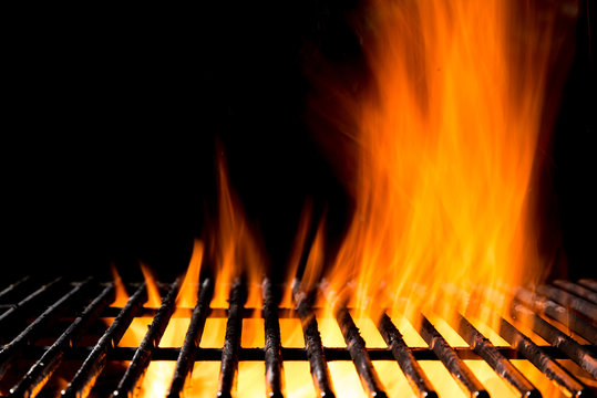 Empty grill grid with fire flames on black