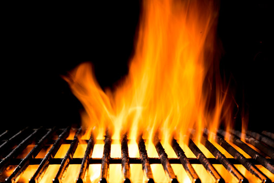 Empty grill grid with fire flames on black