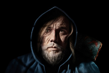 Artistic portrait old man, of mysterious  wanderer in the hood