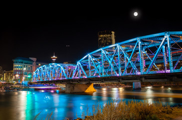 Fototapeta na wymiar Full Moon Over Langevin Bridge in Downtown Calgary