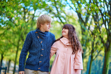 Fototapeta premium Young dating couple in Paris on a bright fall day