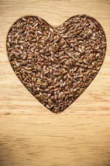 Raw flax seeds linseed heart shaped