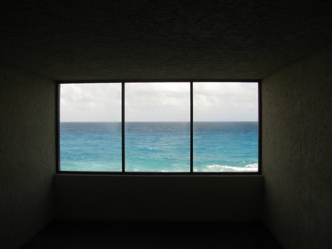 dark window sill and ocean