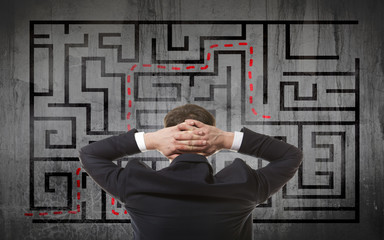 Businessman looking at a maze