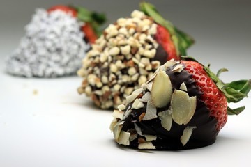 Chocolate coated strawberry with almonds