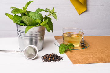 Herbal tea with melissa in a glass cup
