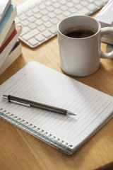 pen with notebook on working table