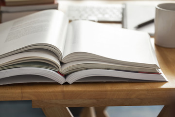 opened book pile put on table