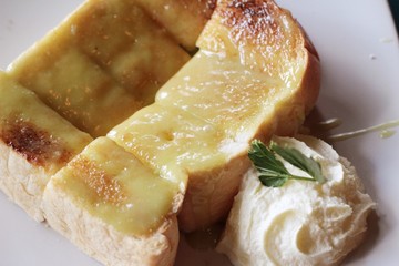 Bread, butter, topped with custard delicious