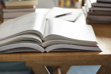 opened book pile put on table