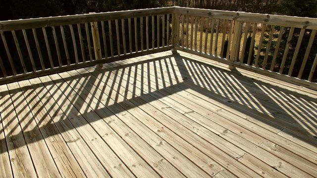Time Lapse Shadows Moving Across Wooden Deck in Back Yard