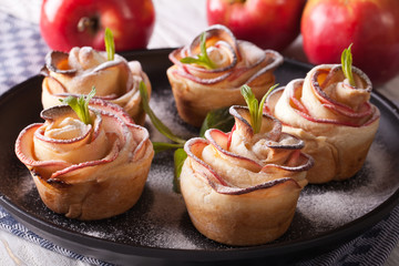 Beautiful apple cake in the form of roses. horizontal closeup
