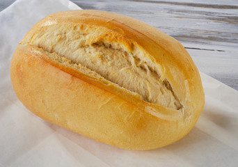 Fresh bread on a wooden board.