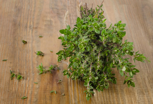 Thyme on a wooden table.
