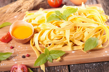 tagliatelle on board with ingredients