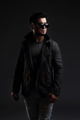 Obraz premium Fashion portrait of handsome stylish man in elegant jacket 