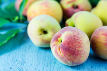 group of fresh peaches on wood background