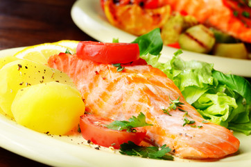 Fried salmon fillet with vegetables