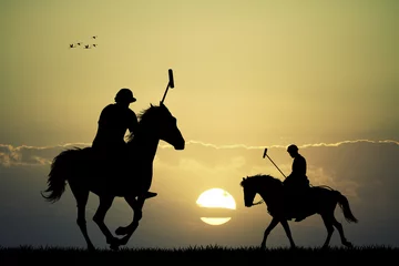 Foto auf Acrylglas Reiten polo players at sunset