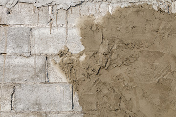 plasterer concrete at wall of house construction