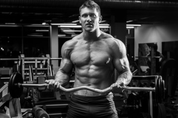 Obraz na płótnie Canvas Man during his workout in gym