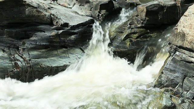 Mountain stream between stones video.