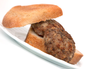 cutlet and bread on a white background