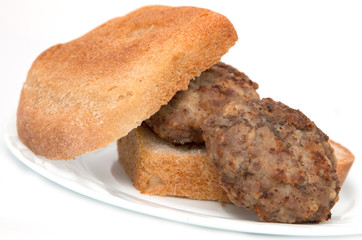 cutlet and bread on a white background