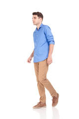Fototapeta premium fashion man walking on isolated background.