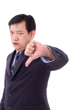 angry, upset, serious businessman giving thumb down