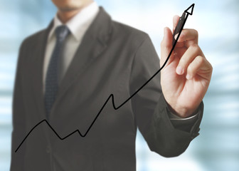 Businessman drawing graphics