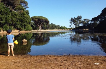 kid playing in the lake