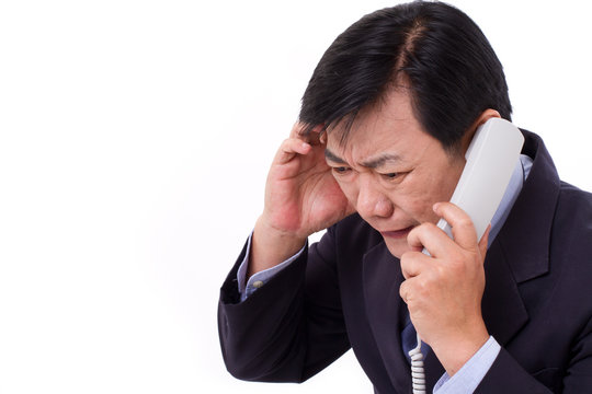 upset, frustrated manager receiving bad news via telephone call,