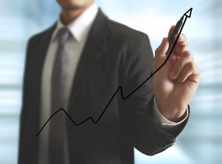 Businessman drawing graphics
