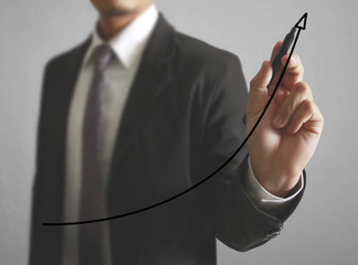 Businessman drawing graphics