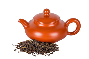 Chinese ceramic teapot and tea leaves on a white background