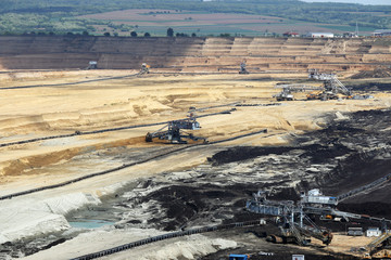 heavy excavators working on open pit coal mine