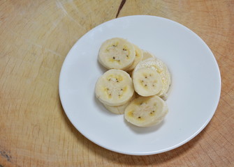 cultivated banana slice on chop block