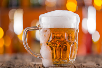 Glass of beer on bar desk