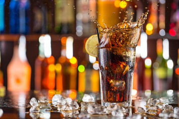 Glass of cola on bar desk
