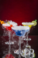 Cocktail with ice vapor on bar desk