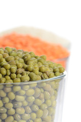 full glasses with mung, lentil and chick-pea isolated on white