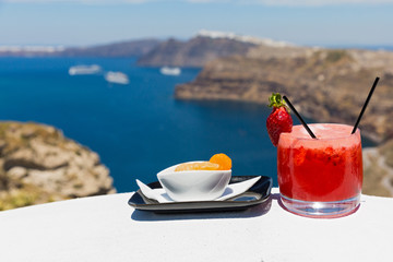 Cold strawberry cocktail and orange