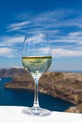 Glass of wine on the background of the sea