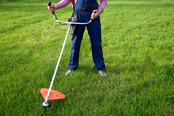 Man mows a grass