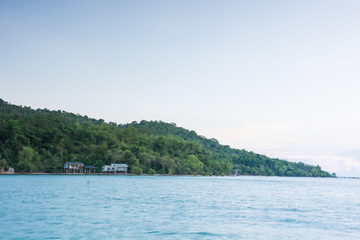 Old house on stilts over the sea